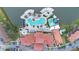 Aerial view of resort-style pool with water slide, deck chairs, umbrellas, and palm trees at 5767 T Bird Ln, Kissimmee, FL 34746