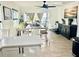 Bright dining room with farmhouse table and seating at 631 Callahan St, Winter Park, FL 32789