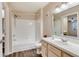 Clean bathroom with a tub, shower, and updated vanity at 7240 Westpointe Blvd # 1115, Orlando, FL 32835