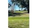 Scenic view of a lush green golf course with trees and pathways at 7240 Westpointe Blvd # 1115, Orlando, FL 32835