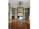 Elegant lobby with hardwood floors, high ceilings, and a grand chandelier at 7240 Westpointe Blvd # 1115, Orlando, FL 32835