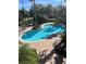 Inviting kidney-shaped swimming pool surrounded by a brick patio at 7240 Westpointe Blvd # 1115, Orlando, FL 32835