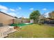 Spacious backyard with artificial turf and garden area at 743 Golden Sunshine Cir, Orlando, FL 32807