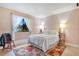 Serene bedroom featuring a queen-size bed and floral rug at 743 Golden Sunshine Cir, Orlando, FL 32807