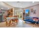 Dining area with wooden table and chairs near kitchen and living room at 743 Golden Sunshine Cir, Orlando, FL 32807