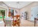 Bright dining area with wood table and chairs near sliding glass doors at 743 Golden Sunshine Cir, Orlando, FL 32807