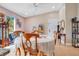 Charming dining area with a round table and wood chairs, overlooking the backyard at 743 Golden Sunshine Cir, Orlando, FL 32807