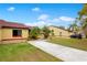 Houses with a shared driveway and lush green lawn under a clear blue sky at 743 Golden Sunshine Cir, Orlando, FL 32807