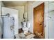 Small bathroom with a toilet, sink, and water heater at 750 E Pearl St, Bartow, FL 33830