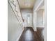 Bright entryway with hardwood floors and staircase at 750 E Pearl St, Bartow, FL 33830