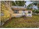 Yellow house with back door and yard at 750 E Pearl St, Bartow, FL 33830