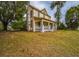 Two-story home with side porch and yard at 750 E Pearl St, Bartow, FL 33830