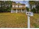 Two-story home with front porch and yard at 750 E Pearl St, Bartow, FL 33830