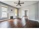 Living room with hardwood floors and a brick fireplace at 750 E Pearl St, Bartow, FL 33830