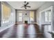 Living room with hardwood floors and a brick fireplace at 750 E Pearl St, Bartow, FL 33830