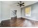 Living room featuring hardwood floors and a view of the staircase at 750 E Pearl St, Bartow, FL 33830