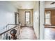 Upper hallway with hardwood floors and original wood banister at 750 E Pearl St, Bartow, FL 33830