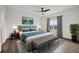 Spacious bedroom with king-size bed and large window at 7859 Summerlake Groves St, Winter Garden, FL 34787