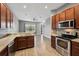 Open kitchen with island and stainless steel appliances at 7859 Summerlake Groves St, Winter Garden, FL 34787