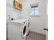 Laundry room with washer, dryer and overhead shelving at 7859 Summerlake Groves St, Winter Garden, FL 34787