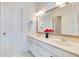 Clean bathroom with double sinks and modern finishes with a large mirror and good lighting at 8513 Bay Hill Blvd, Orlando, FL 32819
