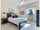 Bright bedroom with a queen-size bed and ample natural light at 8513 Bay Hill Blvd, Orlando, FL 32819