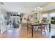 Bright dining area with hardwood floors and view into the living room at 8513 Bay Hill Blvd, Orlando, FL 32819