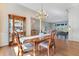 Elegant dining room featuring hardwood floors, a decorative chandelier, and a beautiful china cabinet at 8513 Bay Hill Blvd, Orlando, FL 32819