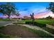 Landscaped entrance with golfer statue and guard house at 8513 Bay Hill Blvd, Orlando, FL 32819