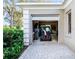 Open garage with golf cart and storage at 8513 Bay Hill Blvd, Orlando, FL 32819