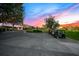 Golf course entrance with golf carts and statue at sunset at 8513 Bay Hill Blvd, Orlando, FL 32819