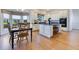 A well-lit kitchen and adjacent dining nook include custom white cabinets and granite countertops at 8513 Bay Hill Blvd, Orlando, FL 32819
