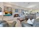 A cozy living room features built-in bookshelves, a fireplace, neutral paint, and plush seating at 8513 Bay Hill Blvd, Orlando, FL 32819