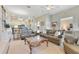This cozy living room features built-in bookshelves and cabinets, neutral paint, and plush seating at 8513 Bay Hill Blvd, Orlando, FL 32819
