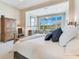 Comfortable bedroom boasts a sitting area and an adjacent desk with large windows and natural light at 8513 Bay Hill Blvd, Orlando, FL 32819