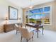 Bright home office featuring a large window with a golf course view, neutral paint, and ceiling fan at 8513 Bay Hill Blvd, Orlando, FL 32819