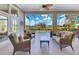 Inviting patio with comfortable seating, offering views of the pool and beautiful landscaping at 8513 Bay Hill Blvd, Orlando, FL 32819