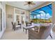Comfortable outdoor patio seating area overlooking the pool and landscaped backyard at 8513 Bay Hill Blvd, Orlando, FL 32819