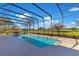 Screened pool and patio area boasting a tranquil golf course view at 8513 Bay Hill Blvd, Orlando, FL 32819