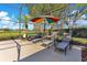 Enclosed pool deck features lounge chairs with view of the golf course at 8513 Bay Hill Blvd, Orlando, FL 32819
