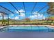 Enclosed pool with sun deck overlooking the golf course at 8513 Bay Hill Blvd, Orlando, FL 32819