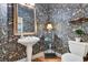 Unique powder room featuring dark floral wallpaper and custom storage solutions at 8513 Bay Hill Blvd, Orlando, FL 32819