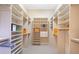 Spacious walk-in closet with custom shelving and ample storage, perfect for organization at 8513 Bay Hill Blvd, Orlando, FL 32819