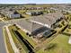 Aerial view of a house with a screened-in pool and fenced backyard at 943 Gracie Ridge St, Clermont, FL 34715