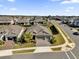 Aerial view of a house and neighborhood with landscaping and a driveway at 943 Gracie Ridge St, Clermont, FL 34715