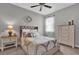 Bedroom with a dresser, nightstand, and queen-size bed at 943 Gracie Ridge St, Clermont, FL 34715