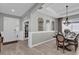 Elegant dining room with a wood table, chandelier, and gray walls at 943 Gracie Ridge St, Clermont, FL 34715