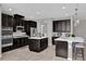 Spacious kitchen with ample counter space and dark wood cabinets at 943 Gracie Ridge St, Clermont, FL 34715