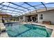 Relaxing pool and patio area with lounge chairs at 943 Gracie Ridge St, Clermont, FL 34715