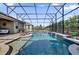 Inviting swimming pool with waterfall feature at 943 Gracie Ridge St, Clermont, FL 34715